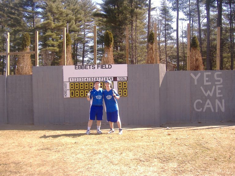 Thomas Hannon and Tom Hannon infront of right field wall